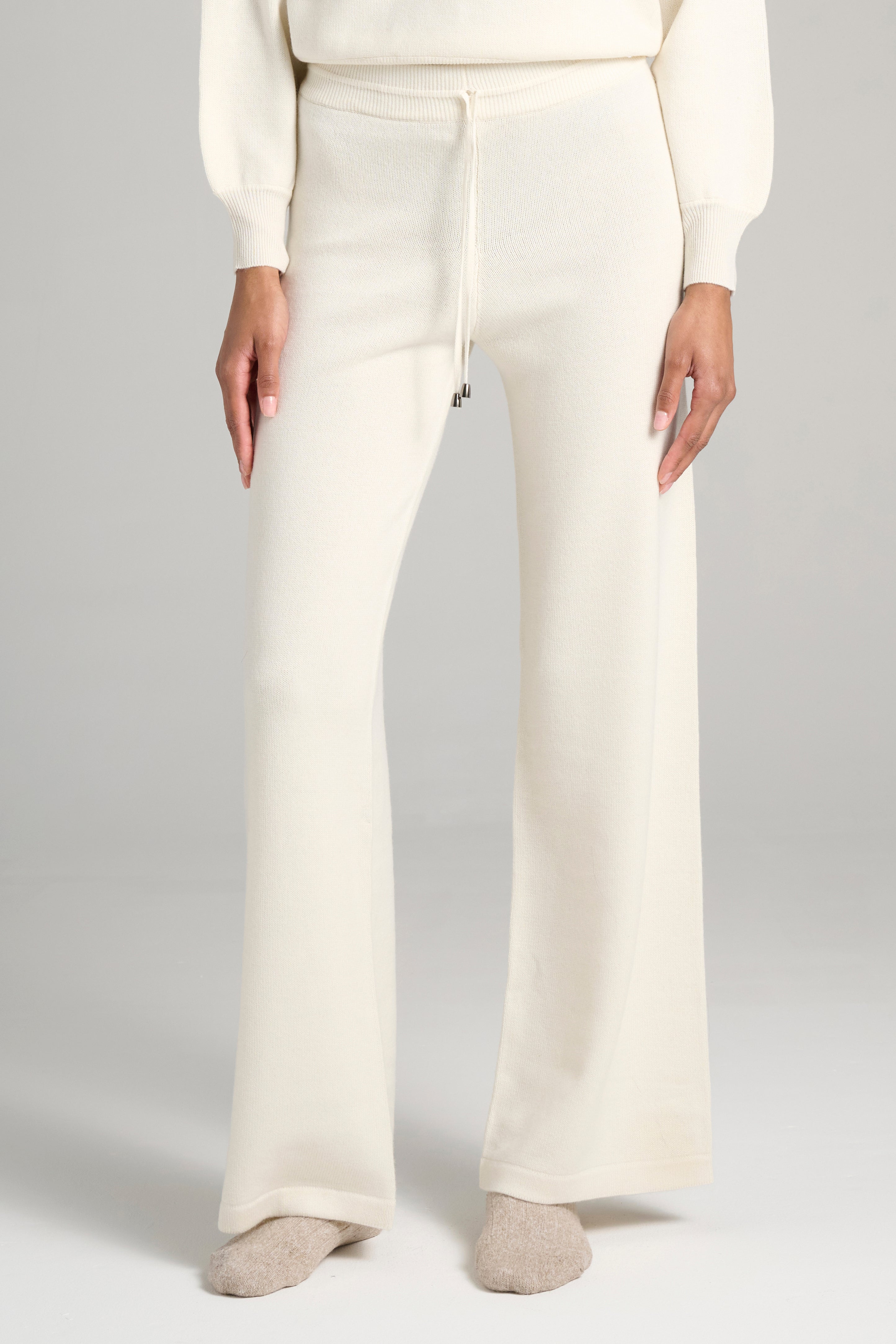Close-up of cream-colored Cariaggi cashmere. Soft and smooth texture in 100% Italian yarn.