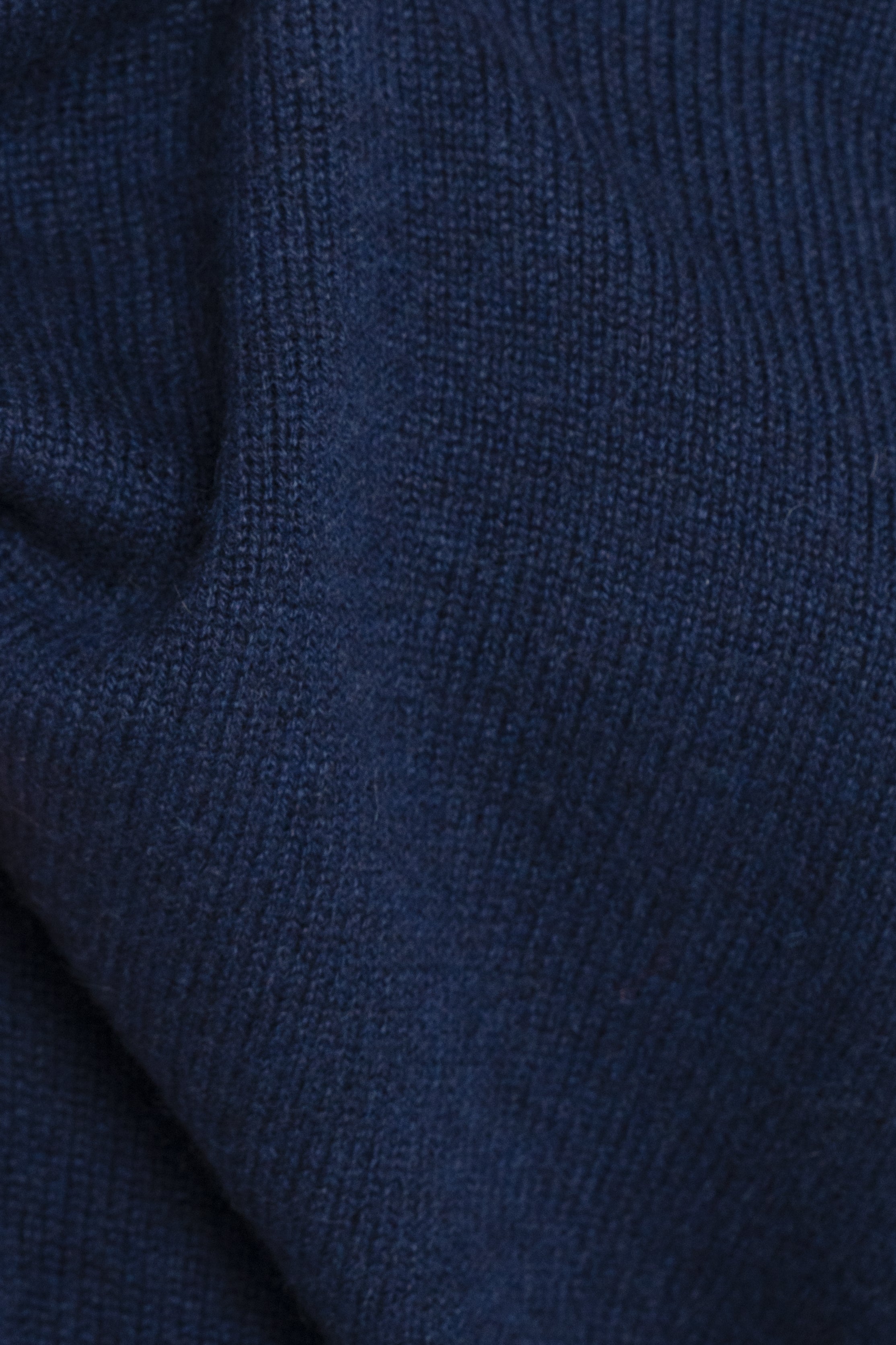 A sophisticated 100% cashmere sweater in Navy, crafted with Cariaggi yarn, offering warmth and style for an elevated, timeless look.